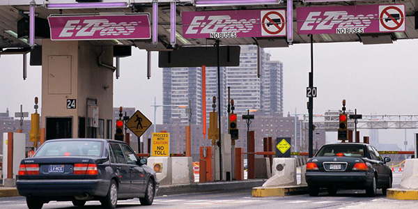 cars going through toll booths