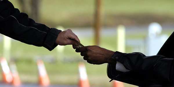 two people making a money-exchange