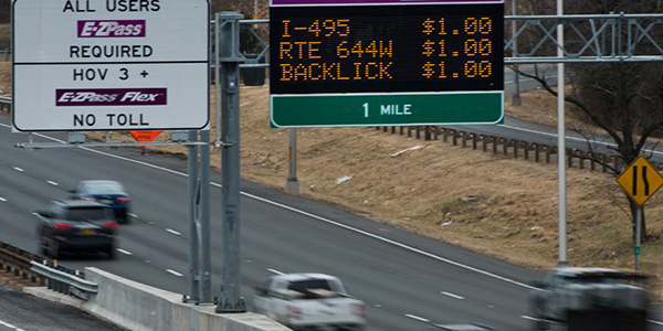 aerial view of a highway and toll signs