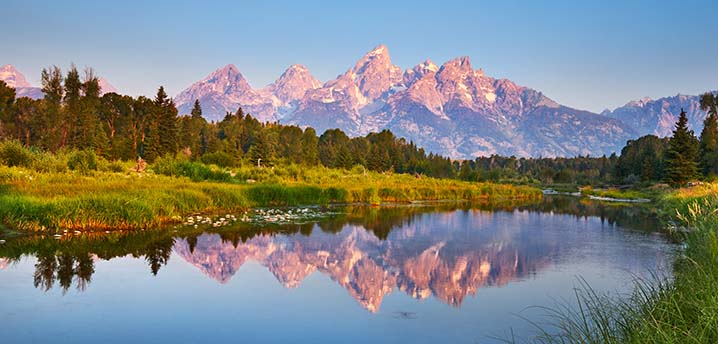 Scenic view of Grand Teton National Park over the Snake River in Wyoming | Top 10 States for Auto Refinance Savings