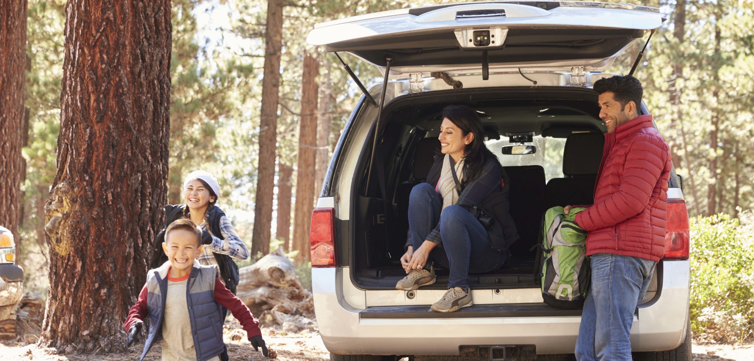 A family exploring outdoors in their hatchback | Sedan or Hatchback: Which Is Best?