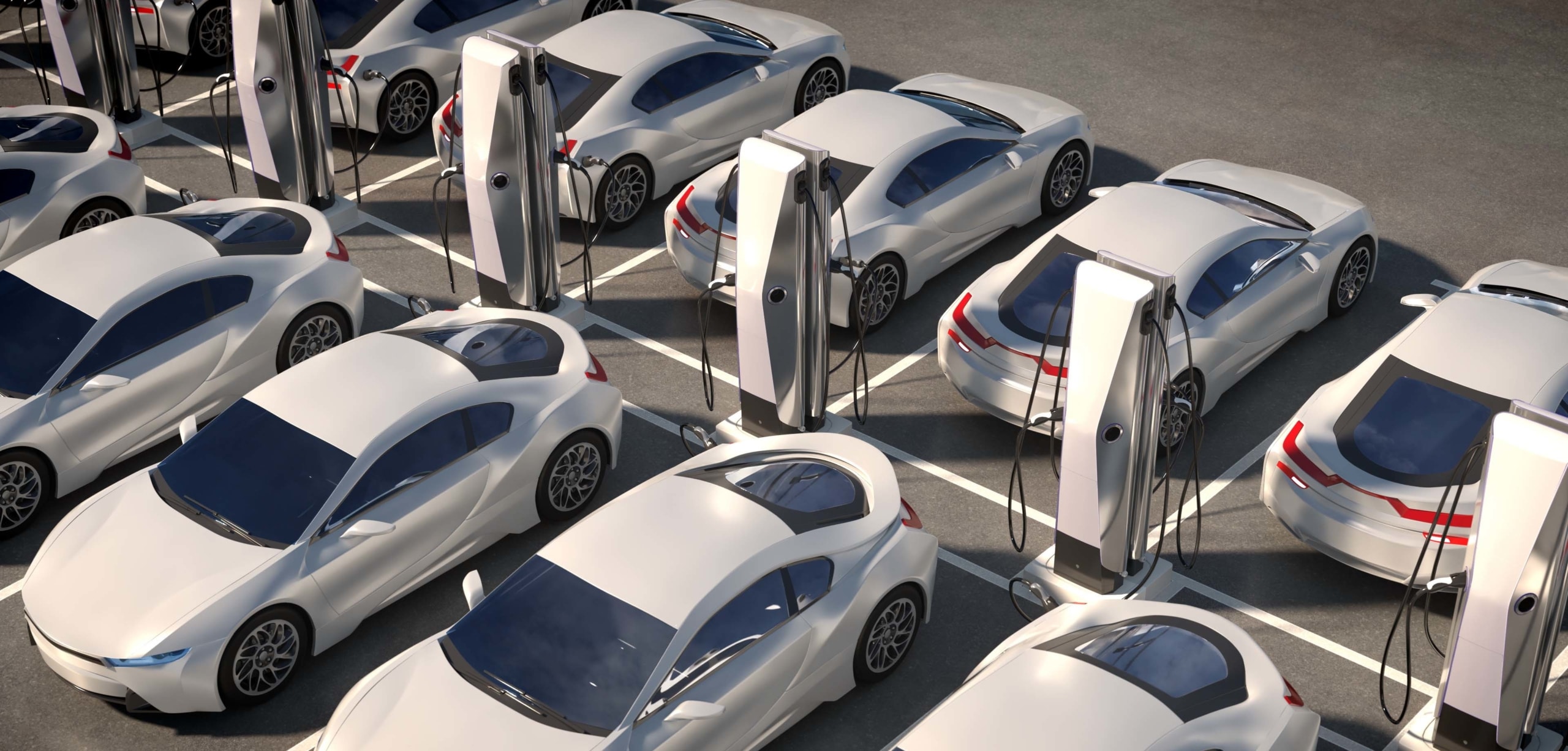 Two parking lot rows are filled with charging electric cars | Electric Vehicle Rebates