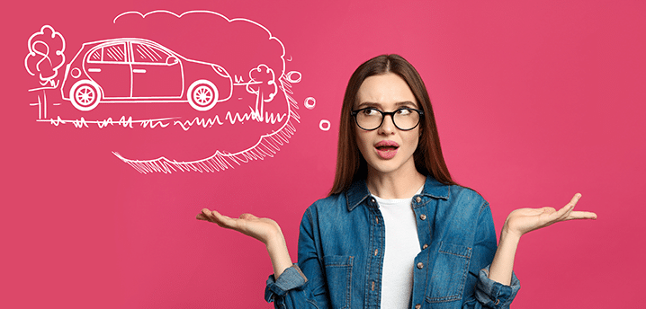 Woman in denim shirt and glasses shrugging with a car illustration in a thought bubble | Can I trade in my upside-down car?