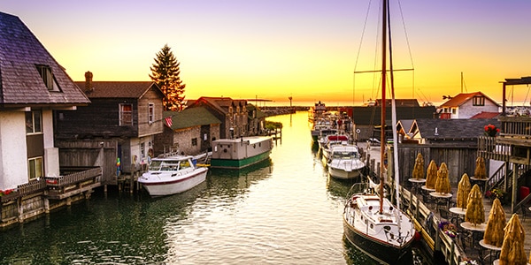 Sunset over sailboats in Leland, Michigan