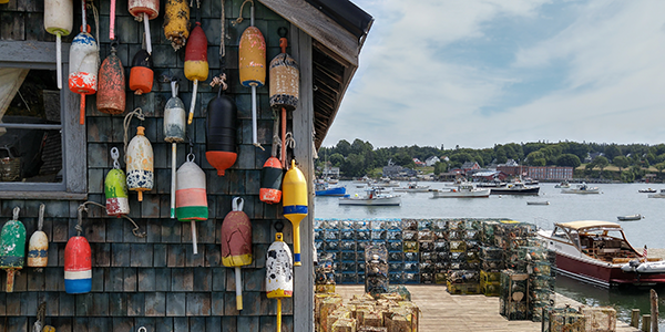 Colorful buoys on a lobster fishing wharf in Maine | States Best and Worst Auto Refinance Rates