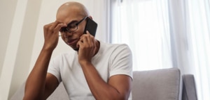 Man frustrated while on the phone