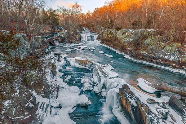 Icy water flowing over the Great Falls of the Potomac River in Maryland during winter | Top 10 States for Auto Refinance Savings