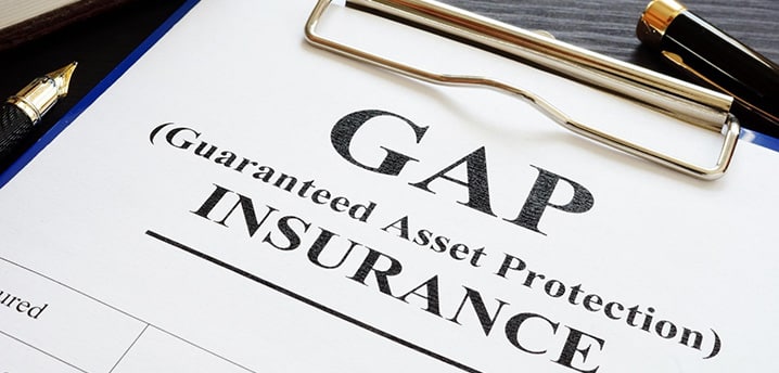 GAP insurance policy on desk with pen