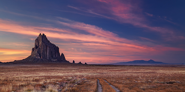 Purple sunset over Shiprock in New Mexico | States Best and Worst Auto Refinance Rates