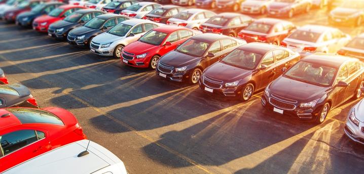 New cars lined up in a dealership car lot