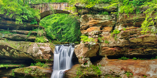 Waterfall under a bridge in Ohio | States Best and Worst Auto Refinance Rates