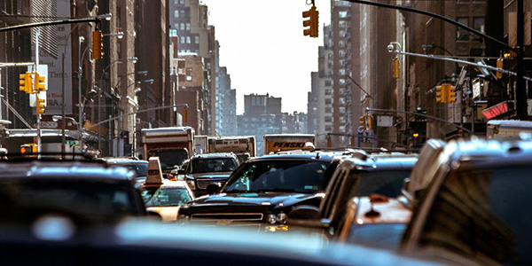 street view of busy traffic in New York County, New York