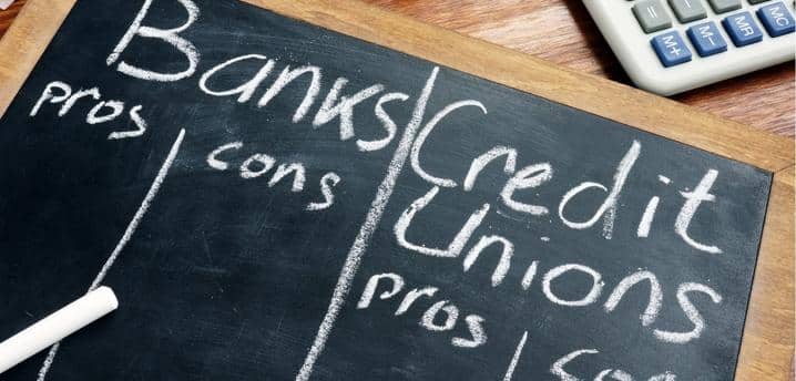 Chalkboard with pros and cons of banks versus credit unions