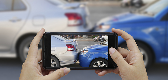 taking photo of car accident - car insurance auto refinance