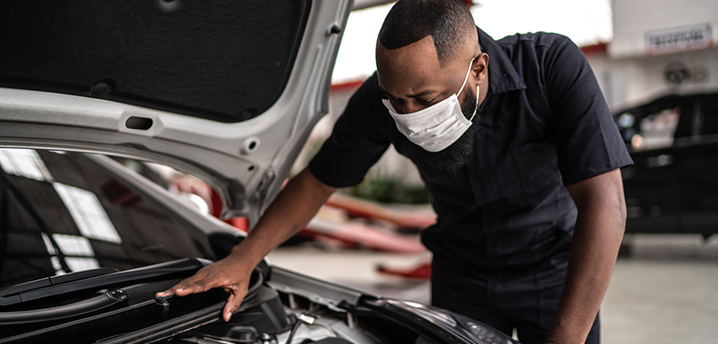 car mechanic doing maintenance during coronavirus pandemic