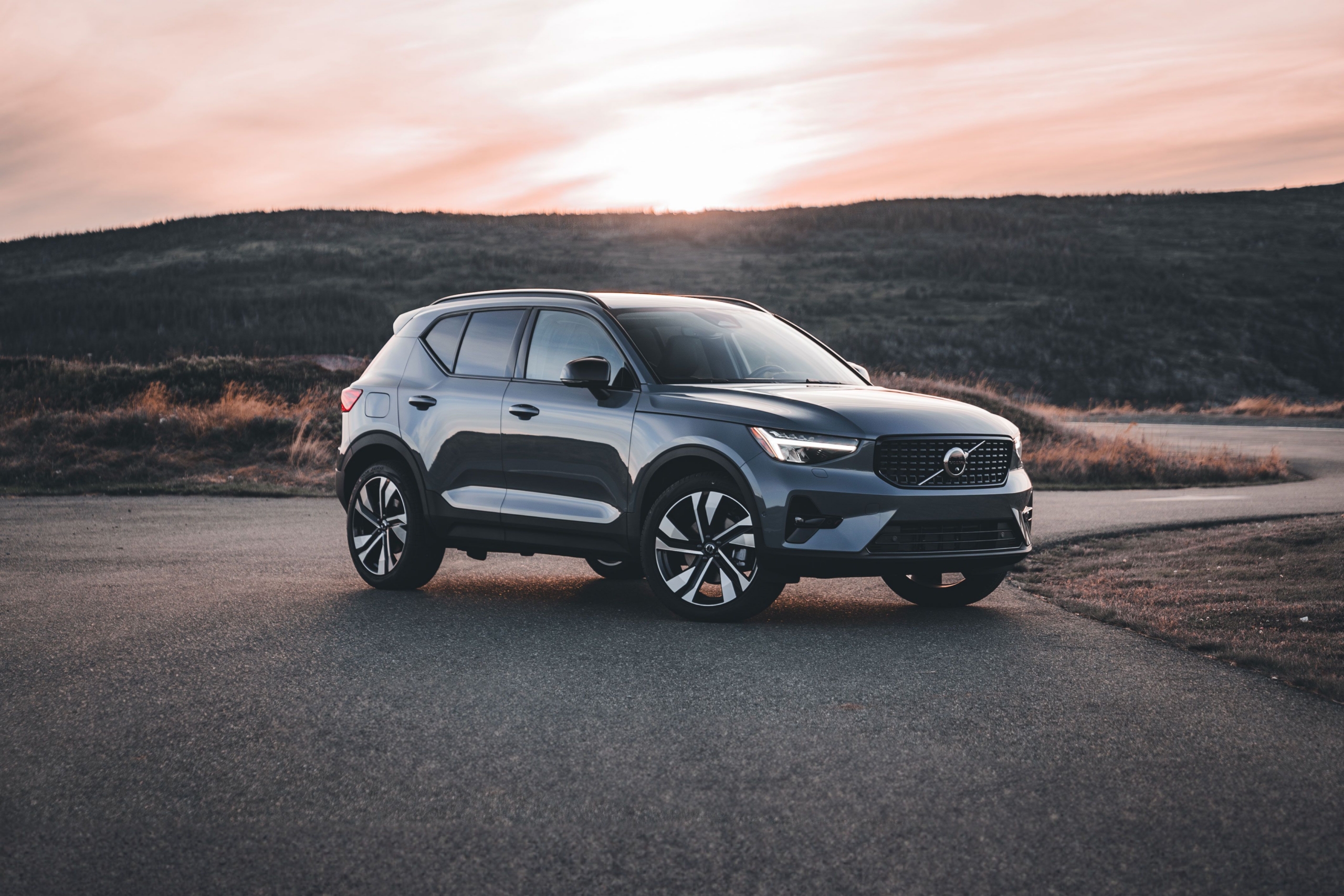 Car Volvo parked with mountain background.