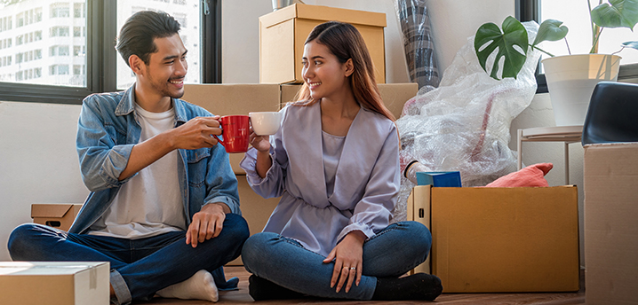 couple celebrating after successfully saving money for a home