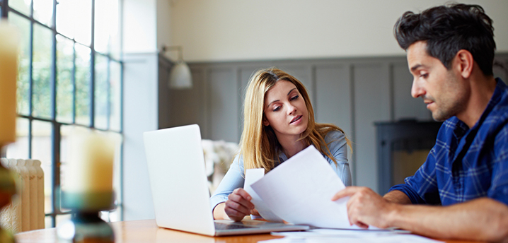 couple looking at power of attorney form car loan refinance