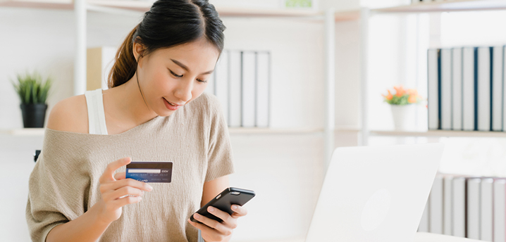 woman learning how to improve credit score on her phone