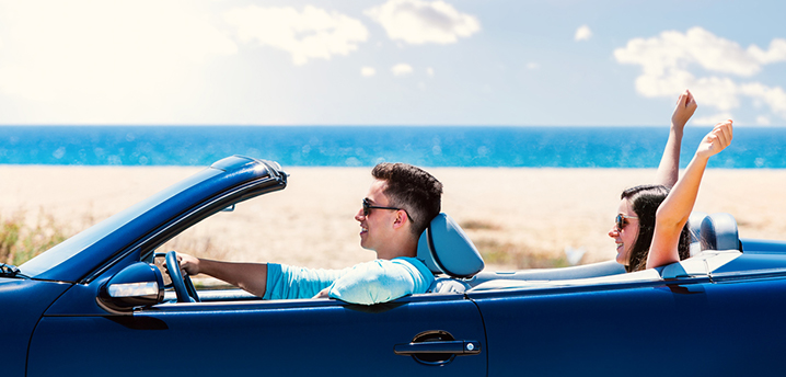 couple cruising down beach in new car - how soon can i refinance my car loan