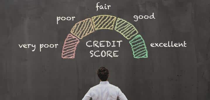 man looking at a credit score on a blackboard