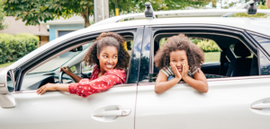 mother daughter road trip in new car with lien