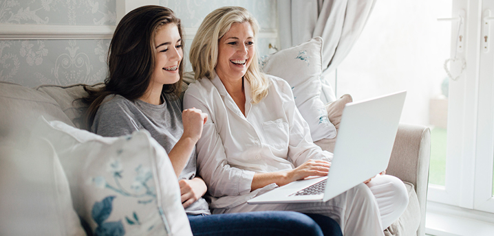 mother teaching daughter about building credit