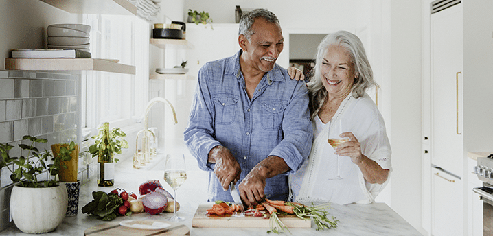 retired couple cooking dinner - how to refinance car loan when retired