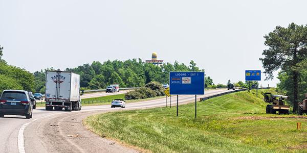 cars and trucks driving on a highway