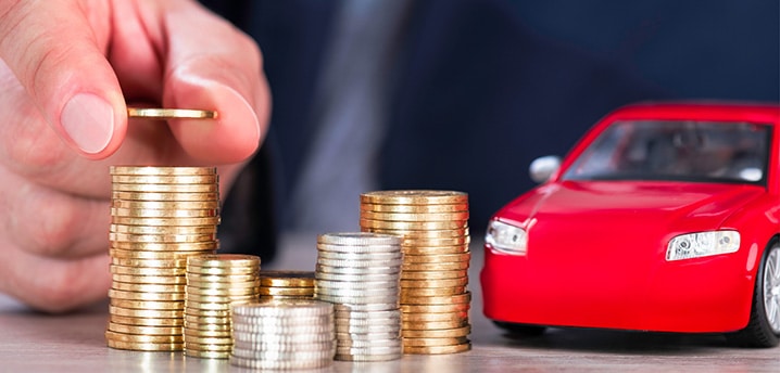 stacking coins next to a toy car