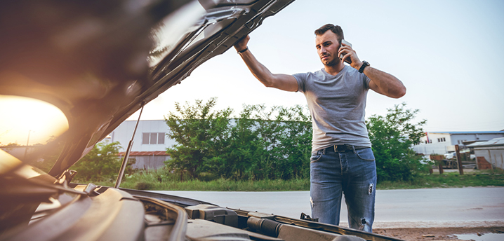 stranded man wishing he had vehicle service contract