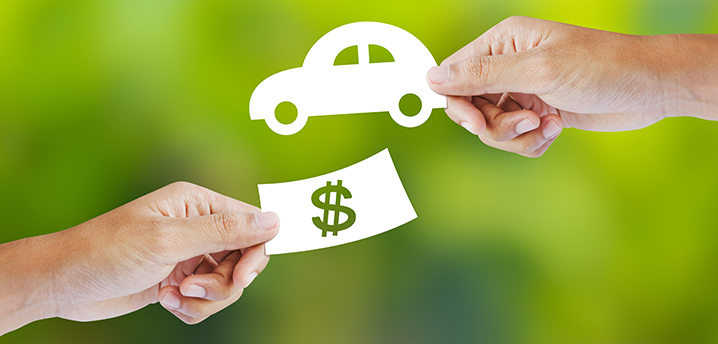 vehicle hands hold money and car cut-outs - vehicle bookouts refinance