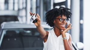 woman holding keys after purchasing new car with no credit and no cosigner