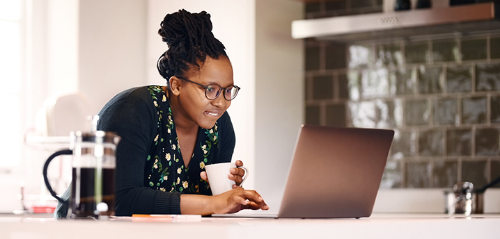 woman researching prepayment penalty for car loan on laptop